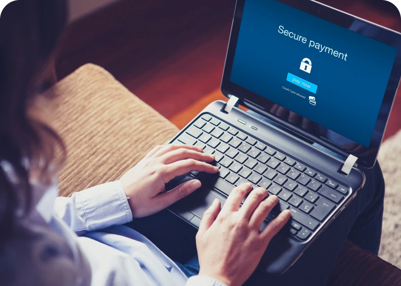 Person using laptop for secure payment.