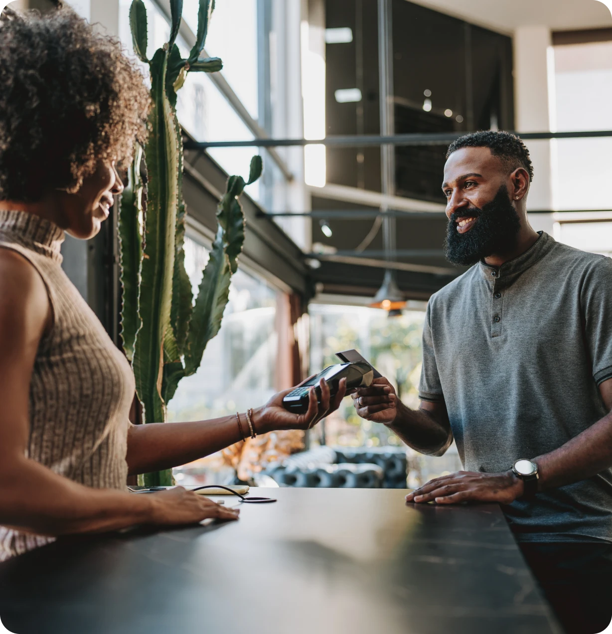 Person making payment at a modern store.